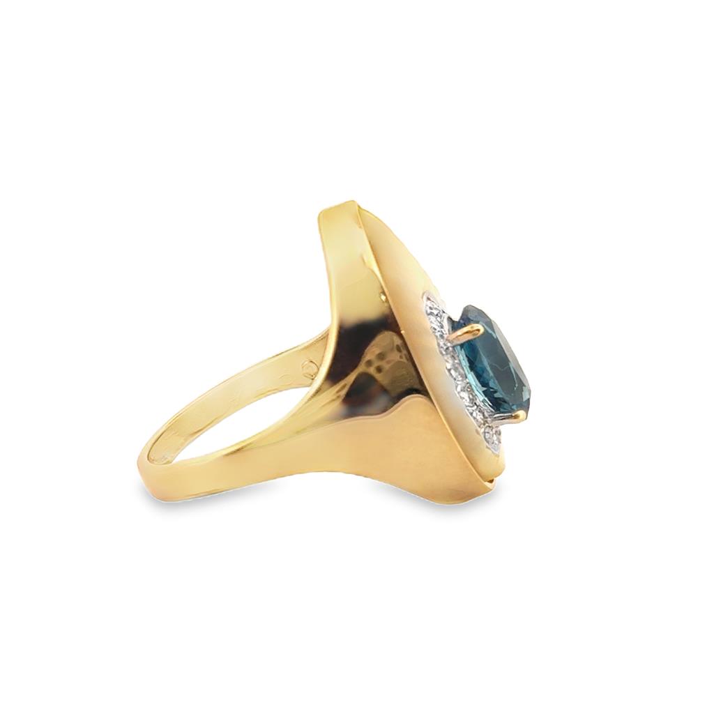 14K Yellow Gold Ring with Oval Blue Topaz and 0.18 CTW Round Diamonds, Size 7.5